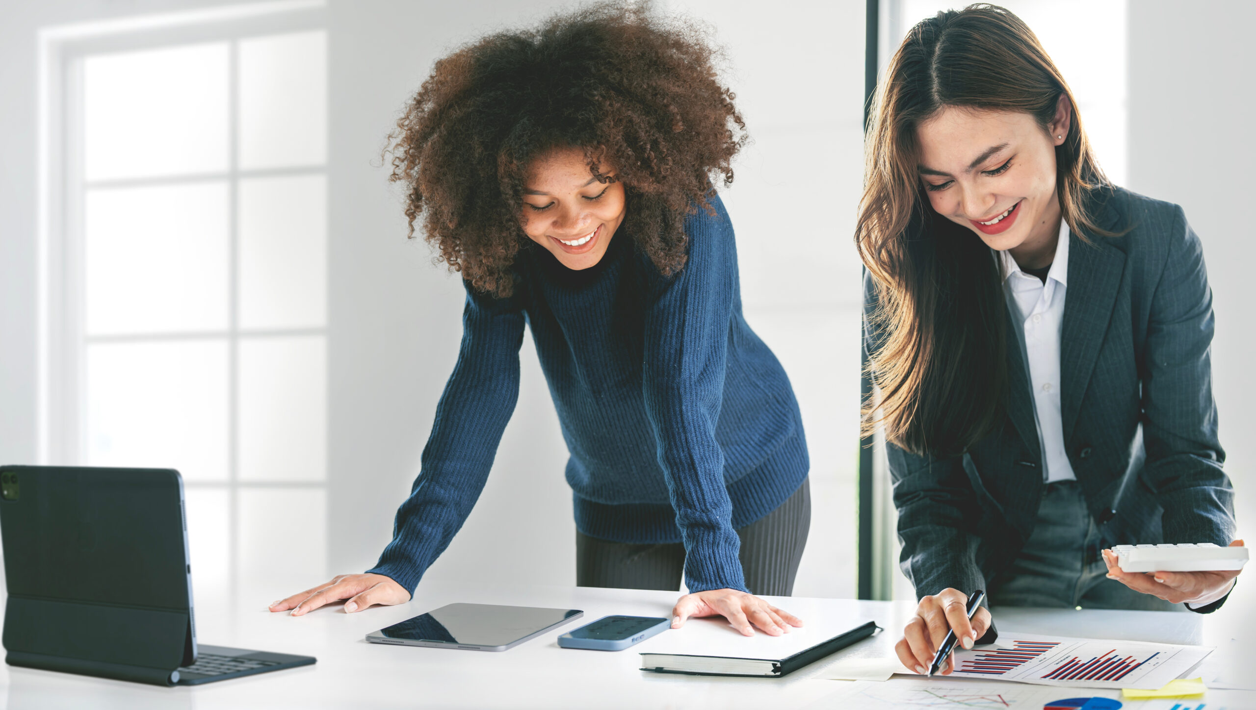 Two businesswoman working together at office.