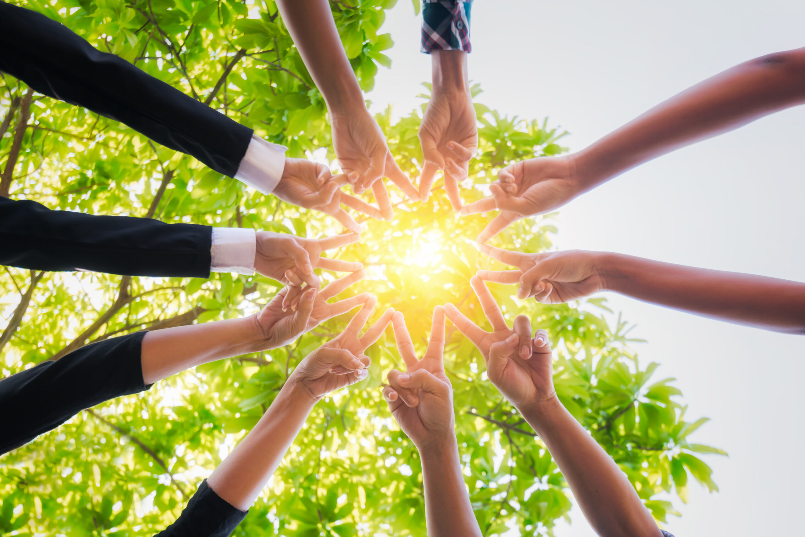Teamwork putting their hands together,business team with stack of them hands showing unity,join hands partnership concept.